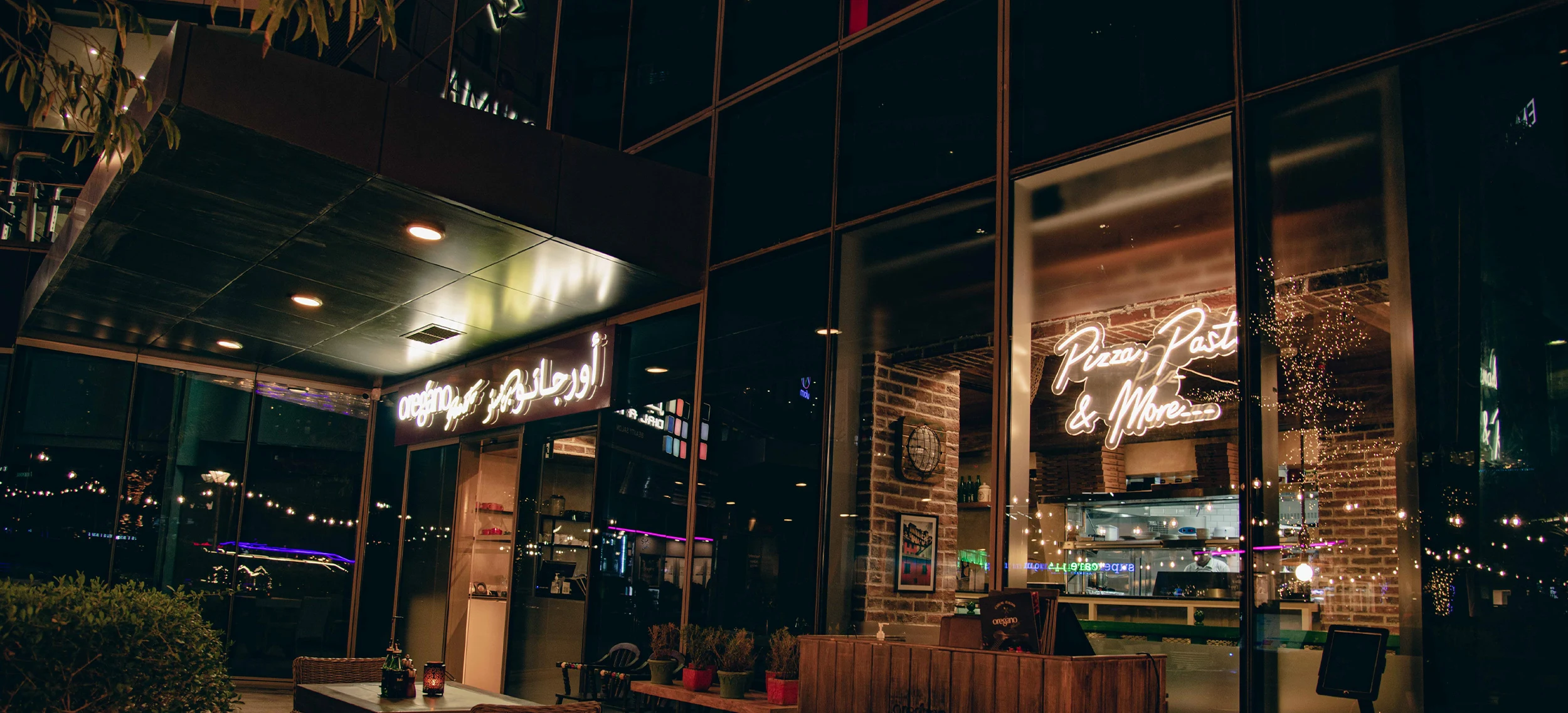 Oregano storefront at night